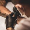 tattoo artist making a tattoo