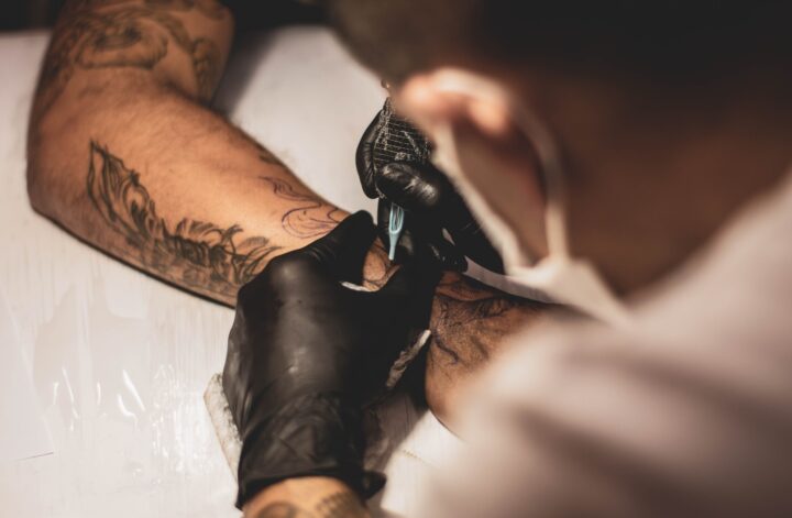 tattoo artist making a tattoo