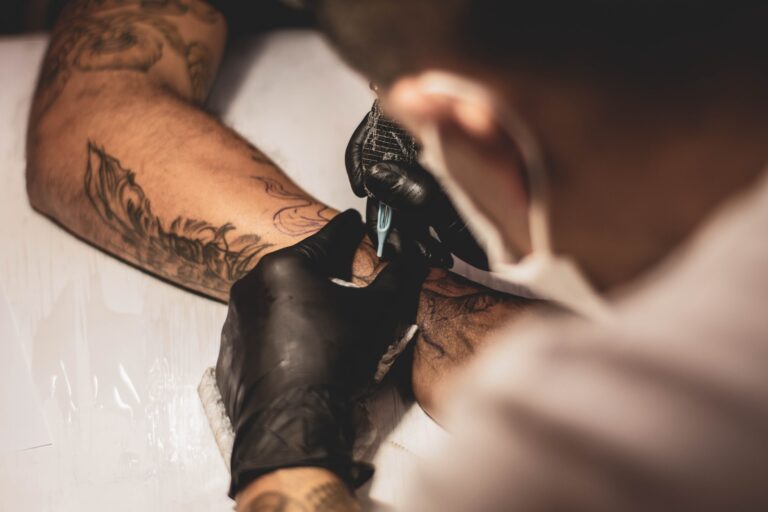 tattoo artist making a tattoo